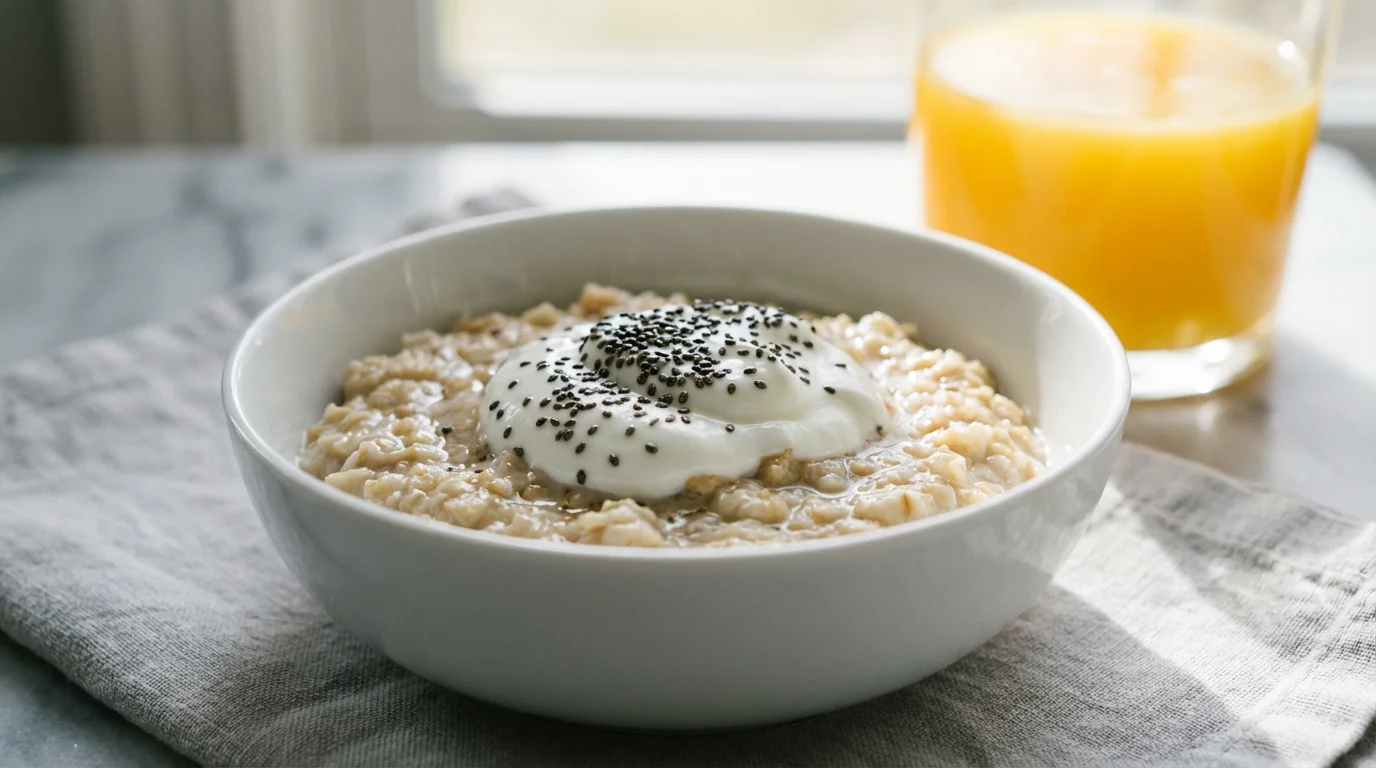 Close-up macro photo of a healthy oatmeal bowl with Greek yogurt and chia seeds.